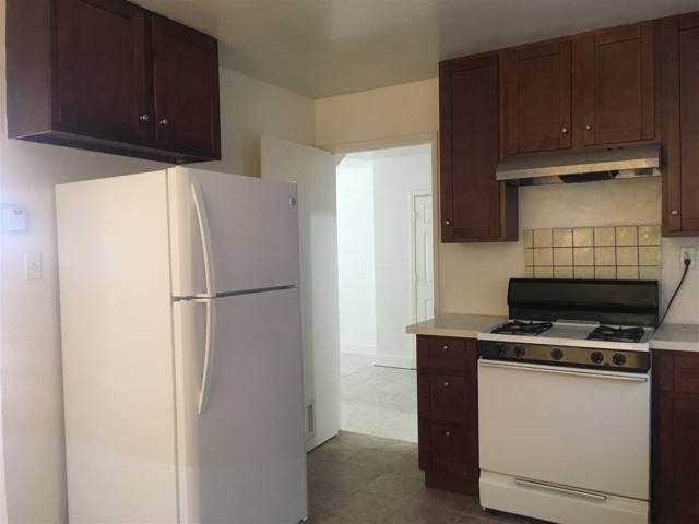 Kitchen with refrigerator and pantry