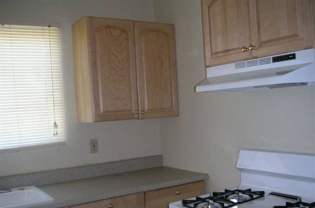 Kitchen with light wood cabinets