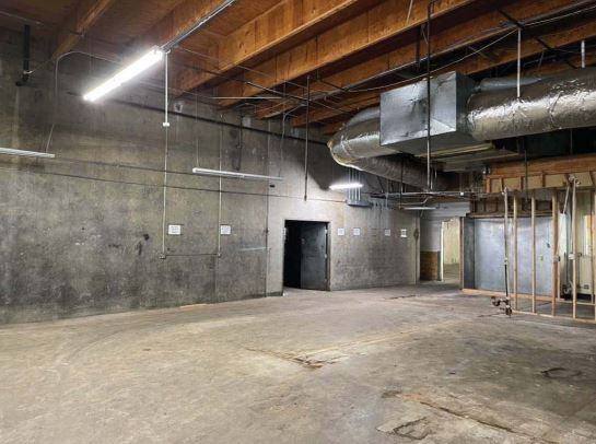 Unit 112 — high ceilings and open ductwork